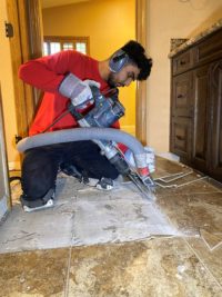 A picture of a DustSharkz dust free tile removal expert removing tile in Glendale